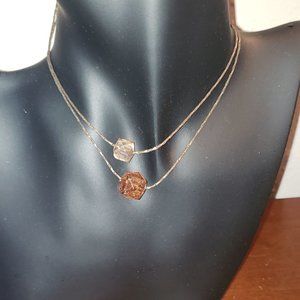 Rose gold necklace with tan bead pendants